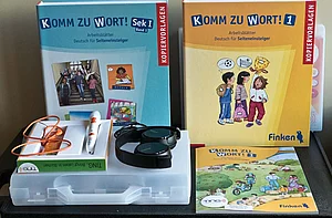 DAZ-Sprachlernkoffer und die Hörbücher "Komm zu Wort! Sek. 1, Band 1" und "Komm zu Wort" , Grundsschule Band 1